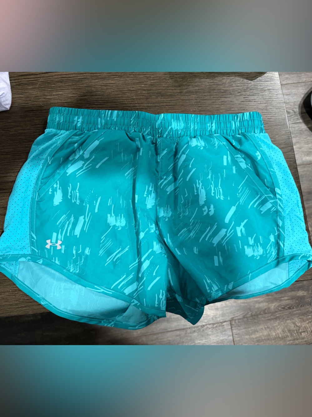 Under Armour Turquoise Running Shorts with Subtle Print